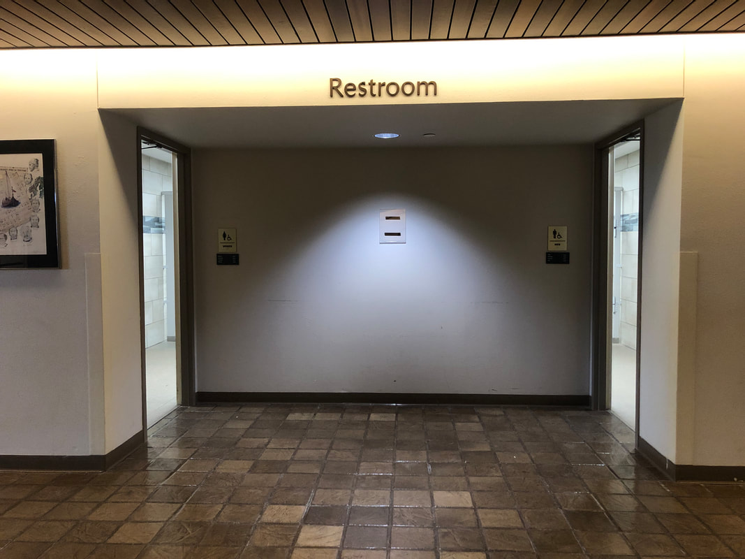 Interior photo of museum showing location of restrooms on main floor.