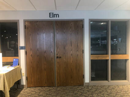 Interior photo of museum showing the entrance to the Elm conference room. 